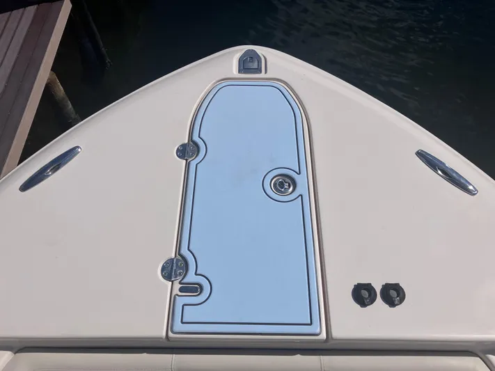  Yacht Photos Pics 2018 Grady-White Canyon 336 boat deck, featuring sleek design and storage hatch.