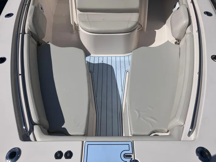  Yacht Photos Pics 2018 Grady-White Canyon 336 boat interior with cushioned seating and deck.