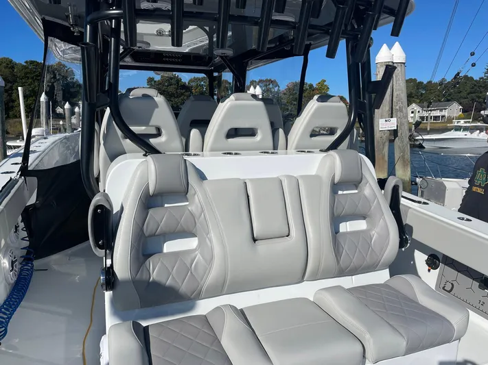 Tunnel Vision Yacht Photos Pics Luxurious seating on a 2024 Freeman 42LR boat, featuring modern design and comfort.