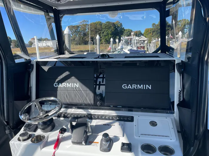 Tunnel Vision Yacht Photos Pics 2024 Freeman 42LR boat cockpit with dual Garmin displays and steering wheel.