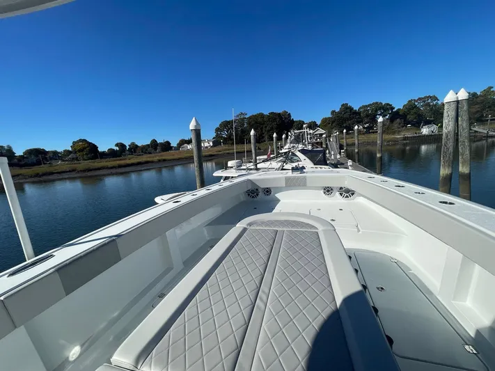 Tunnel Vision Yacht Photos Pics 2024 Freeman 42LR boat docked on calm water under clear blue sky.
