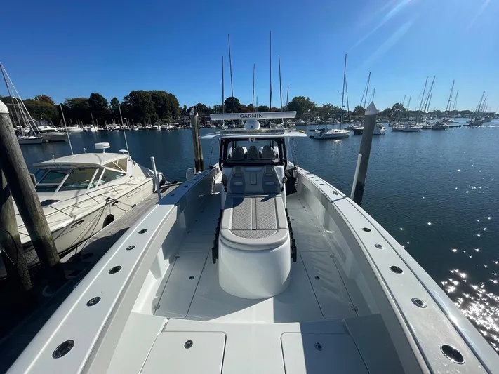 Tunnel Vision Yacht Photos Pics 2024 Freeman 42LR boat docked in a sunny marina, surrounded by other vessels.