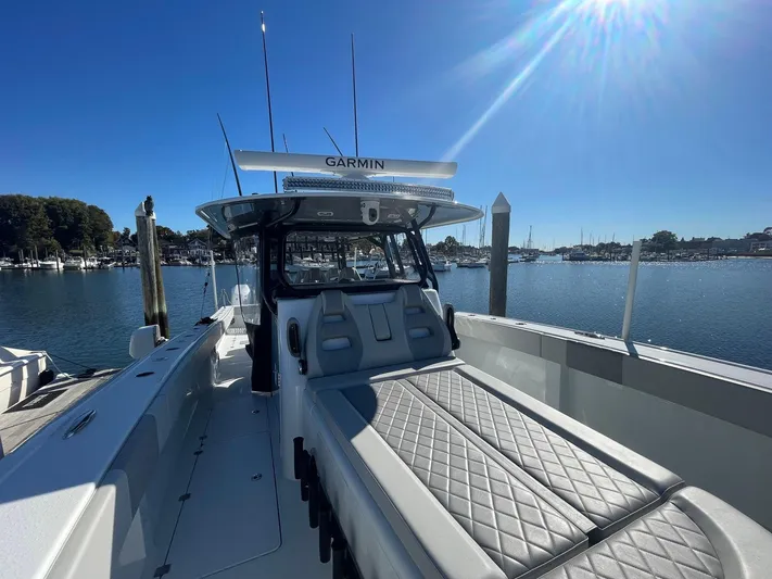 Tunnel Vision Yacht Photos Pics 2024 Freeman 42LR boat docked, featuring Garmin equipment, under clear blue sky.