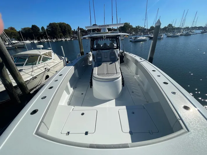 Tunnel Vision Yacht Photos Pics 2024 Freeman 42LR boat docked in a marina, surrounded by other vessels.