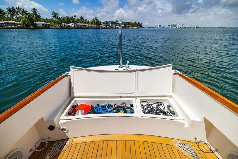  Yacht Photos Pics Hinckley Talaria 29 R 2004 boat deck with storage compartments, overlooking calm waters.