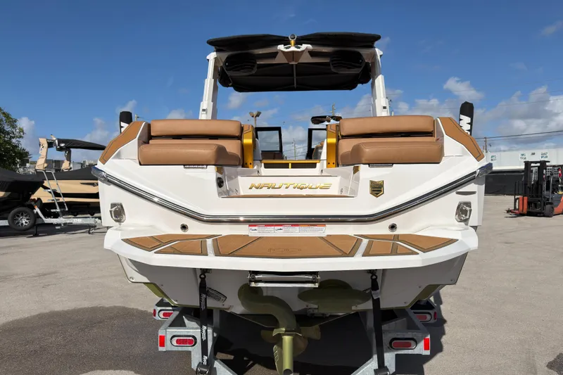  Yacht Photos Pics 2025 Nautique Super Air Nautique G25 Paragon boat, rear view, on trailer, sunny day.