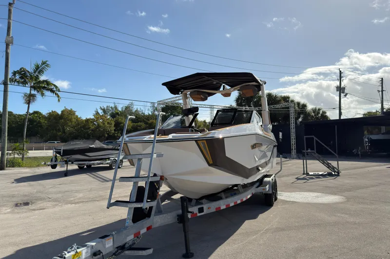  Yacht Photos Pics 2025 Nautique Super Air Nautique G25 Paragon on trailer under clear sky.