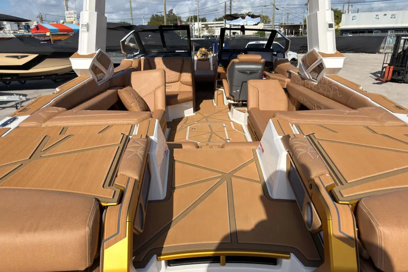  Yacht Photos Pics 2025 Nautique Super Air Nautique G25 Paragon interior with luxurious tan seating and modern design.