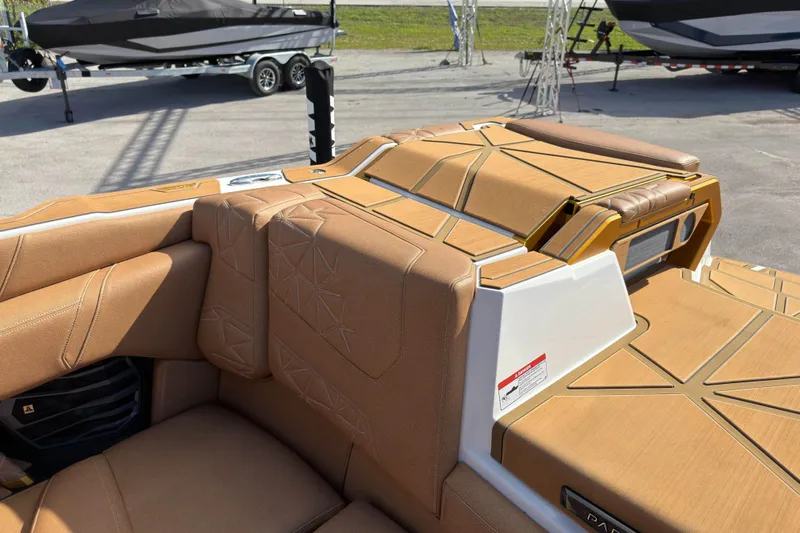  Yacht Photos Pics 2025 Nautique Super Air Nautique G25 Paragon interior with tan upholstery and modern design.