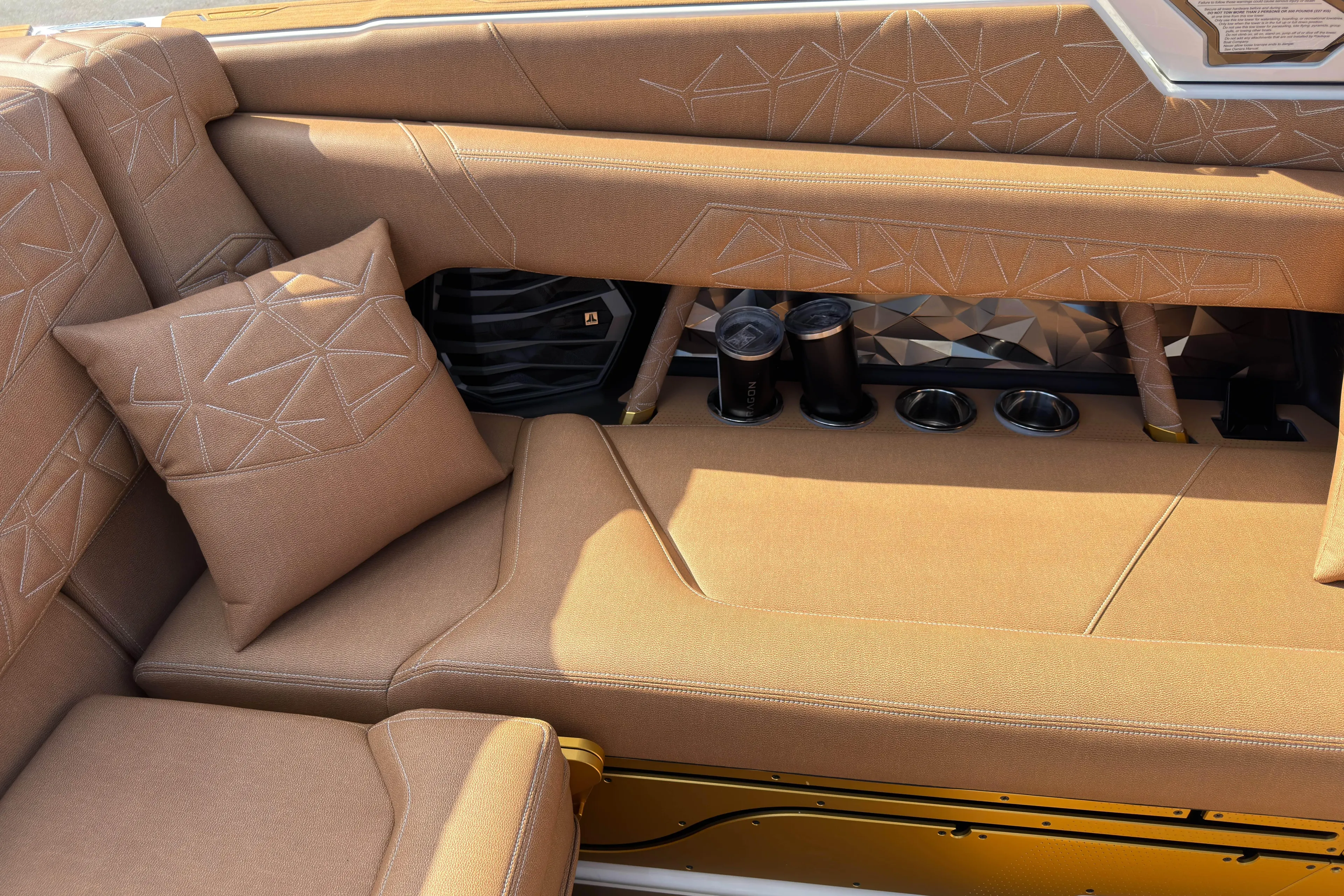  Yacht Photos Pics Luxurious interior of 2025 Nautique Super Air Nautique G25 Paragon with plush seating and cup holders.