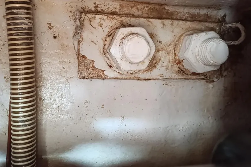  Yacht Photos Pics Close-up of bolts and hose inside a 2004 Jeanneau Sun Odyssey 43 yacht.