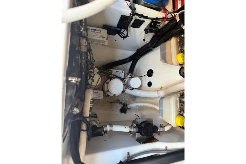  Yacht Photos Pics Engine compartment of 2016 Extreme Boats 38 Cuddy Cabin, showcasing wiring and components.