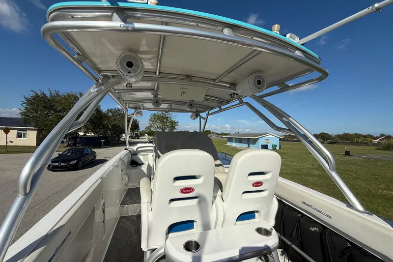  Yacht Photos Pics 2016 Extreme Boats 38 Cuddy Cabin interior with seating and canopy, parked outdoors.