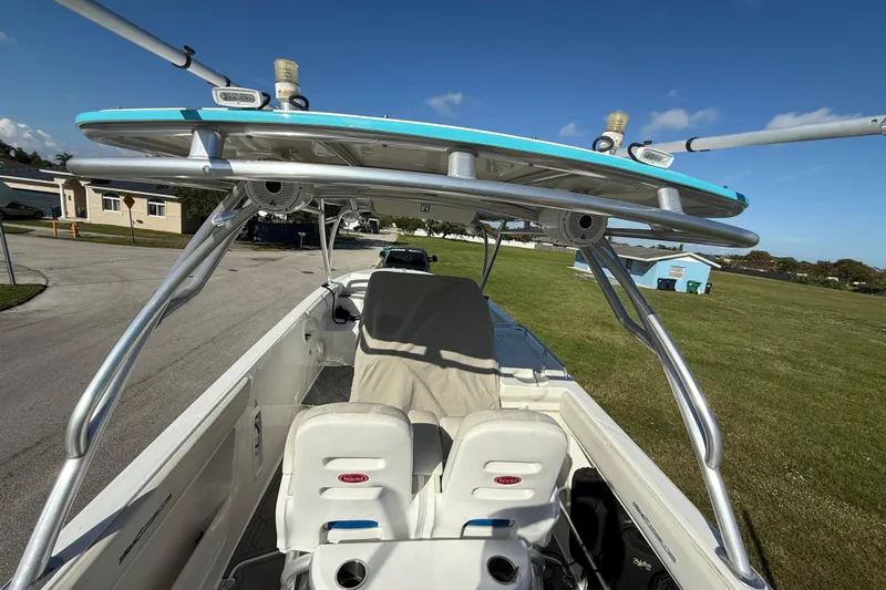  Yacht Photos Pics 2016 Extreme Boats 38 Cuddy Cabin with T-top and seating, parked on grass.