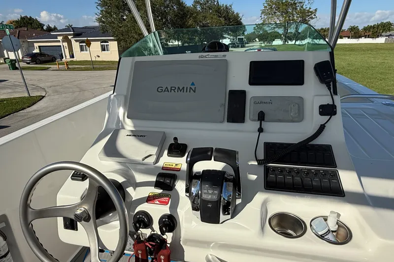  Yacht Photos Pics 2016 Extreme Boats 38 Cuddy Cabin dashboard with Garmin navigation system and controls.
