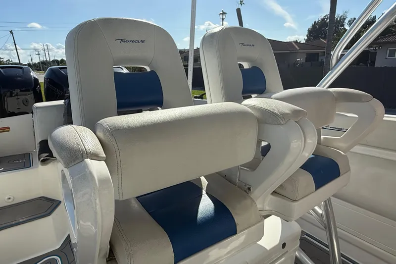  Yacht Photos Pics 2016 Extreme Boats 38 Cuddy Cabin, featuring comfortable helm seating with blue and white upholstery.