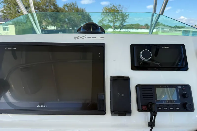  Yacht Photos Pics Control panel of 2016 Extreme Boats 38 Cuddy Cabin with Garmin and Fusion electronics.