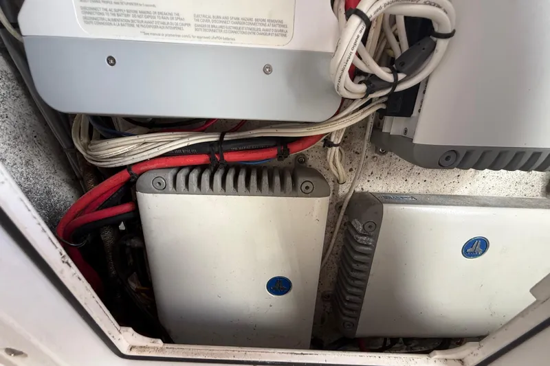  Yacht Photos Pics Electrical components in a 2016 Extreme Boats 38 Cuddy Cabin, featuring wiring and equipment.