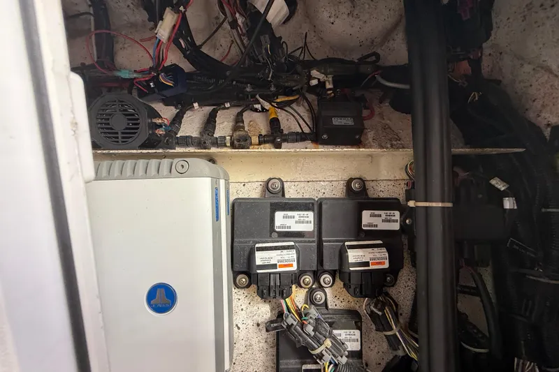  Yacht Photos Pics Electrical components inside a 2016 Extreme Boats 38 Cuddy Cabin, showcasing wiring and devices.