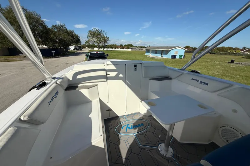  Yacht Photos Pics 2016 Extreme Boats 38 Cuddy Cabin interior with seating and table, parked outdoors.