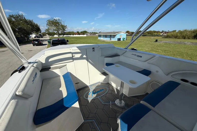  Yacht Photos Pics 2016 Extreme Boats 38 Cuddy Cabin interior with seating and table, parked outdoors.