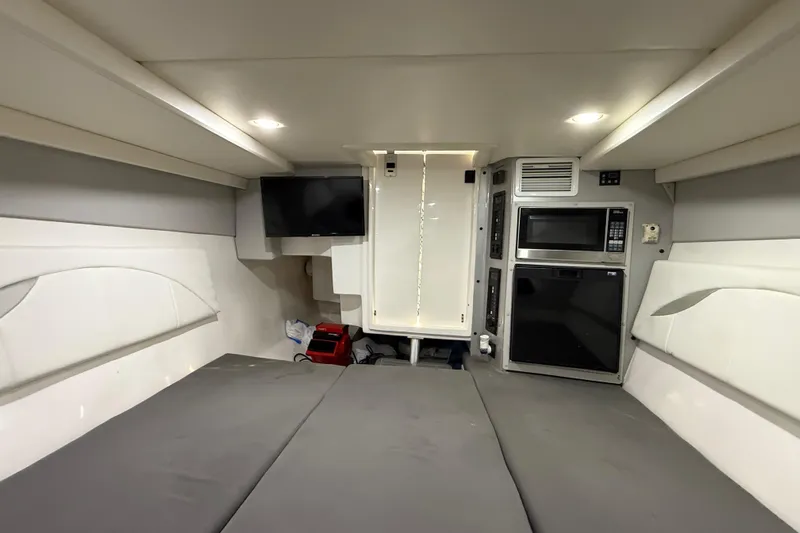  Yacht Photos Pics Interior of 2016 Extreme Boats 38 Cuddy Cabin with modern amenities and cozy seating.
