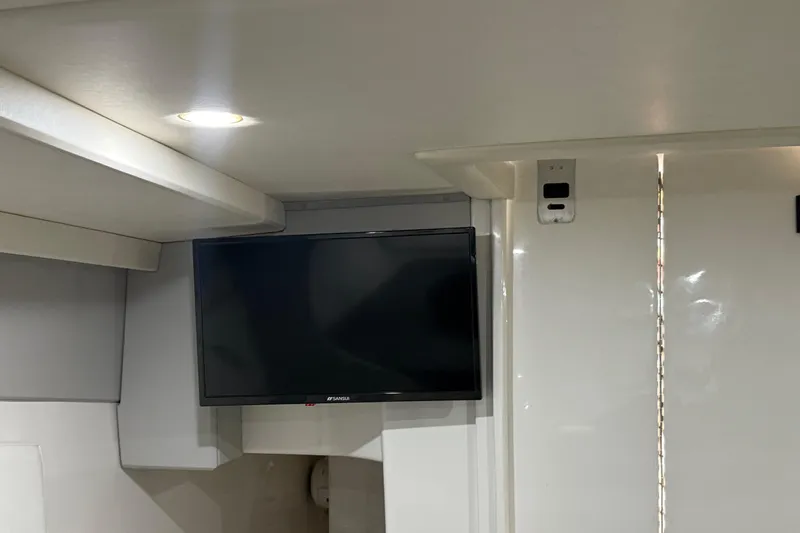  Yacht Photos Pics Interior of 2016 Extreme Boats 38 Cuddy Cabin with wall-mounted TV.