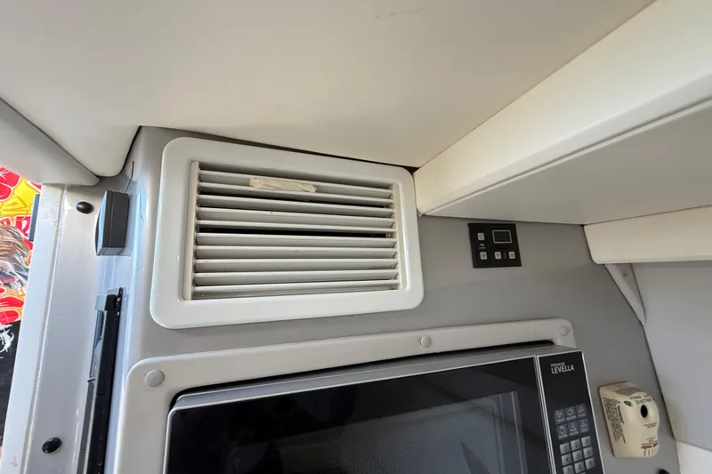  Yacht Photos Pics Interior of 2016 Extreme Boats 38 Cuddy Cabin with vent and microwave.