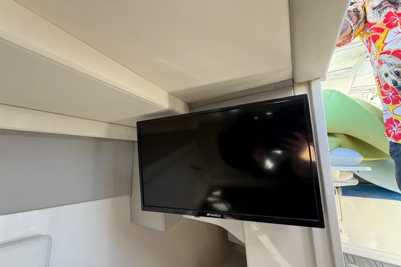  Yacht Photos Pics Interior of 2016 Extreme Boats 38 Cuddy Cabin with mounted TV screen.