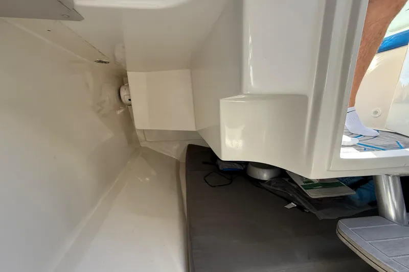  Yacht Photos Pics Interior view of a 2016 Extreme Boats 38 Cuddy Cabin, showcasing sleek design and storage space.