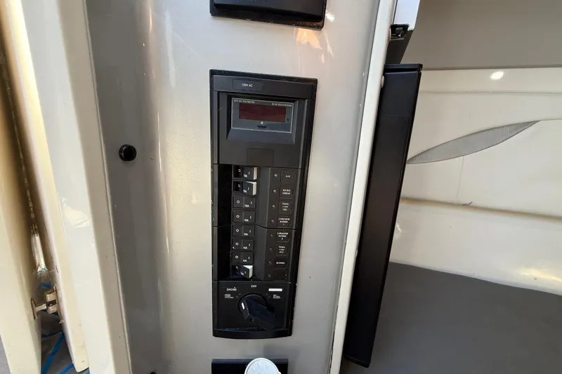  Yacht Photos Pics Control panel inside 2016 Extreme Boats 38 Cuddy Cabin, featuring various switches and settings.