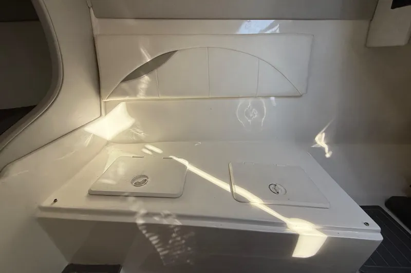  Yacht Photos Pics 2016 Extreme Boats 38 Cuddy Cabin interior with storage compartments.