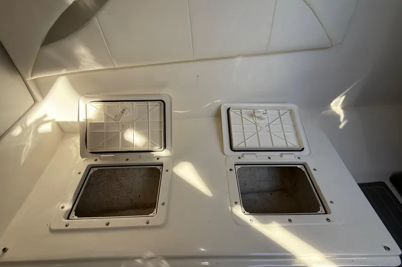  Yacht Photos Pics 2016 Extreme Boats 38 Cuddy Cabin interior with open storage compartments.