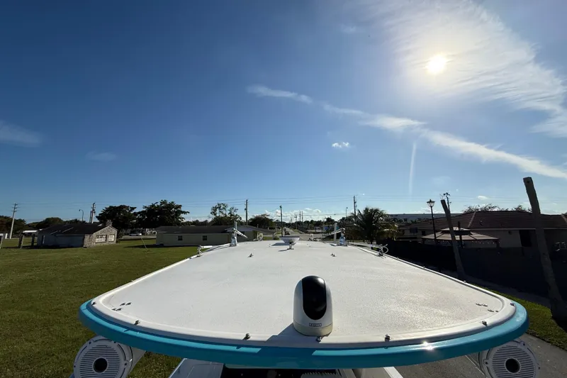  Yacht Photos Pics 2016 Extreme Boats 38 Cuddy Cabin under clear blue sky, showcasing deck and surroundings.
