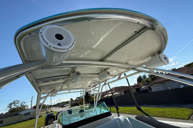  Yacht Photos Pics 2016 Extreme Boats 38 Cuddy Cabin with speakers on the canopy, sunny day view.