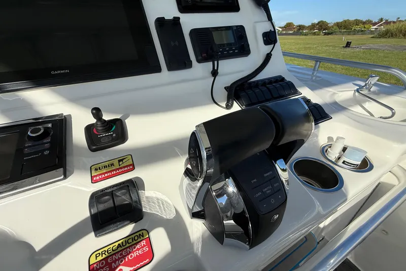  Yacht Photos Pics 2016 Extreme Boats 38 Cuddy Cabin helm with controls and navigation equipment.