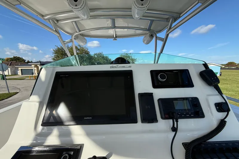  Yacht Photos Pics 2016 Extreme Boats 38 Cuddy Cabin dashboard with navigation and communication equipment.