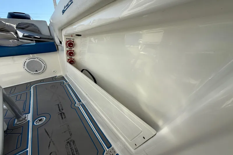  Yacht Photos Pics 2016 Extreme Boats 38 Cuddy Cabin interior with storage compartment and speaker.