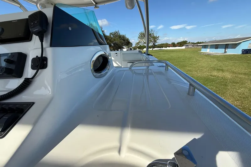  Yacht Photos Pics 2016 Extreme Boats 38 Cuddy Cabin deck with control panel and outdoor view.