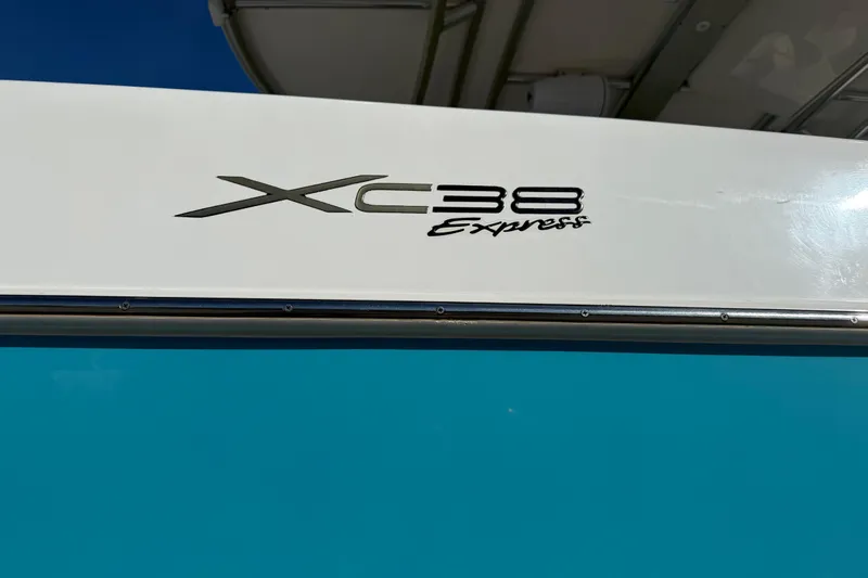  Yacht Photos Pics 2016 Extreme Boats 38 Cuddy Cabin, XC38 Express logo on blue and white hull.
