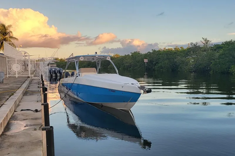  Yacht Photos Pics 2016 Extreme Boats model docked on calm water at sunset.