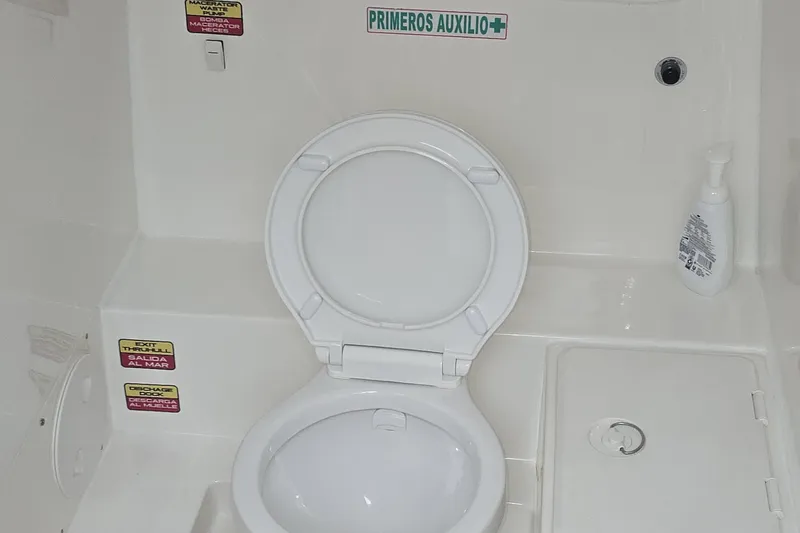  Yacht Photos Pics 2016 Extreme Boats interior with marine toilet and safety labels.