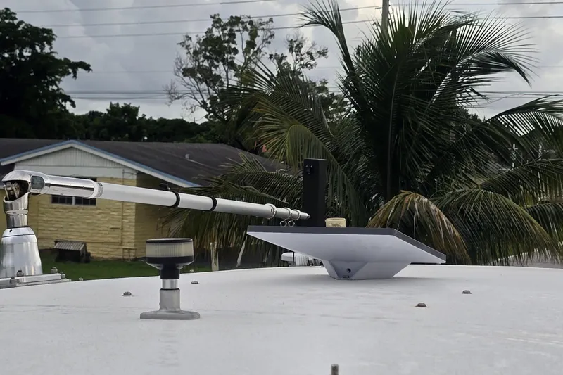  Yacht Photos Pics Rooftop of 2016 Extreme Boats with antenna and satellite dish, surrounded by palm trees.