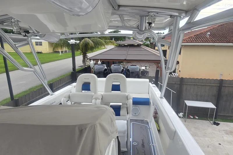  Yacht Photos Pics 2016 Extreme Boats model with seating, parked near a residential area.