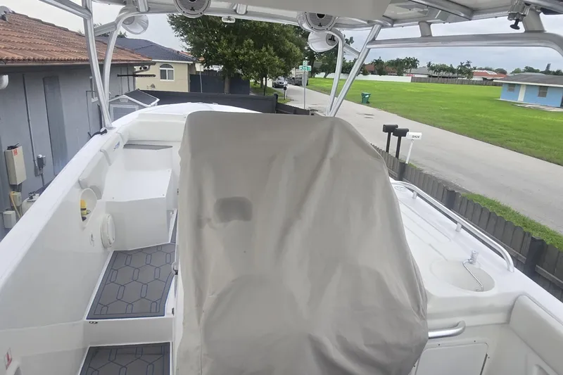  Yacht Photos Pics 2016 Extreme Boats model with covered seating, docked near residential area.