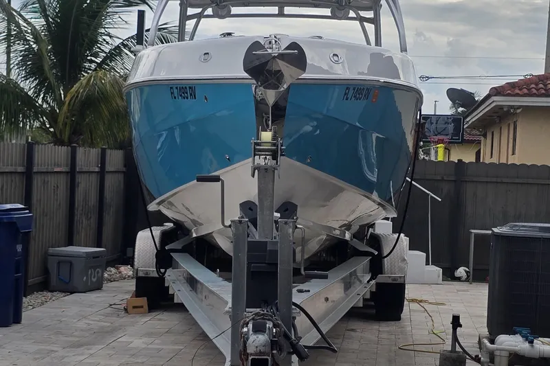  Yacht Photos Pics 2016 Extreme Boats model on trailer, parked in a residential driveway.