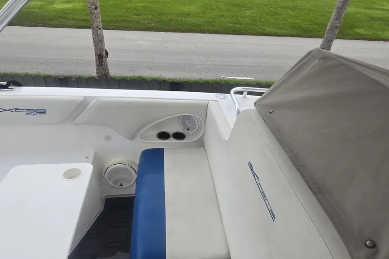  Yacht Photos Pics 2016 Extreme Boats interior with white and blue seating, cup holders, and speaker system.