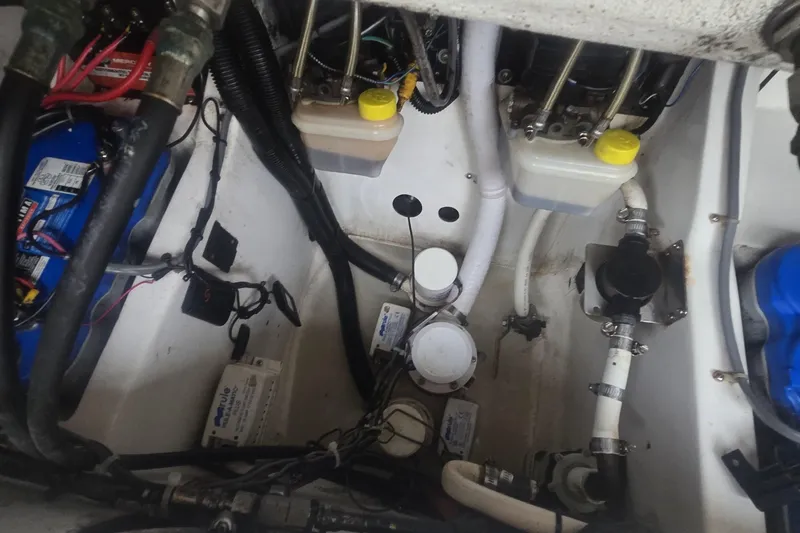  Yacht Photos Pics Engine compartment of a 2016 Extreme Boats model, showcasing wiring and fluid reservoirs.