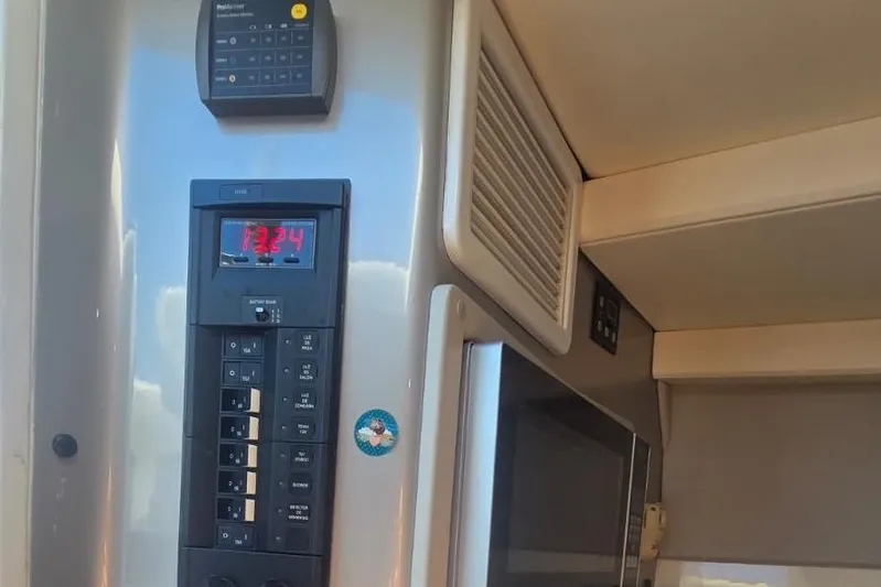  Yacht Photos Pics Control panel inside a 2016 Extreme Boats model, featuring digital display and switches.