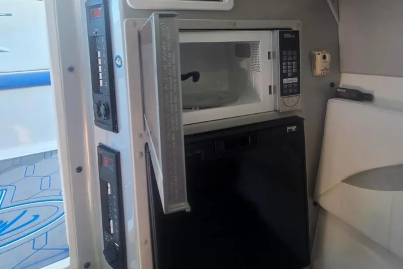  Yacht Photos Pics 2016 Extreme Boats interior with microwave and control panels.